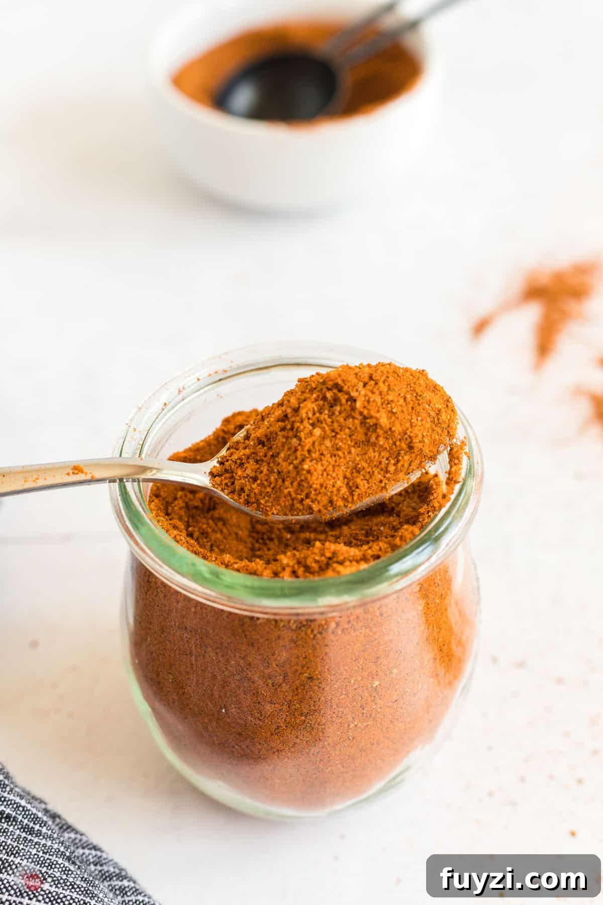 jar of seasoning with spoon