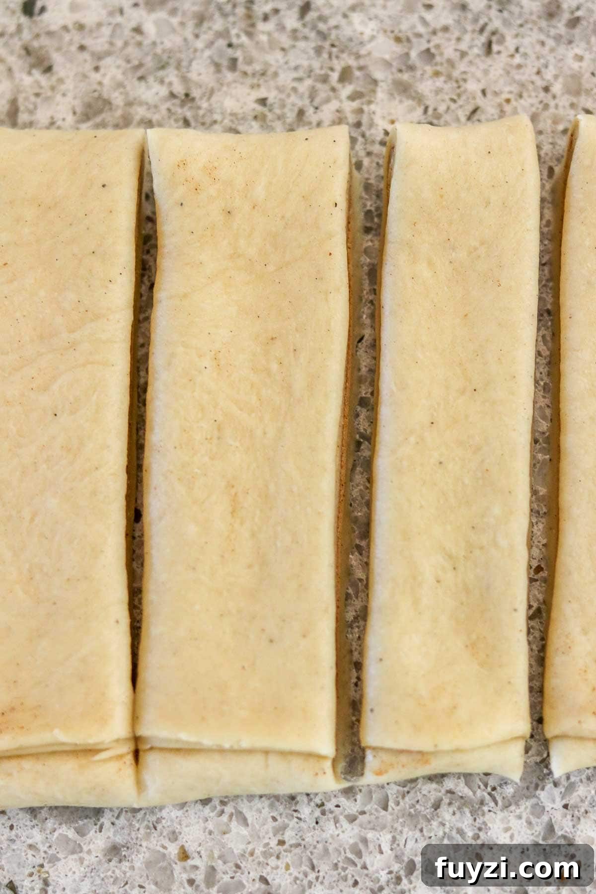 Cut strips of Swedish Cinnamon Bun (Kanelbullar) dough.