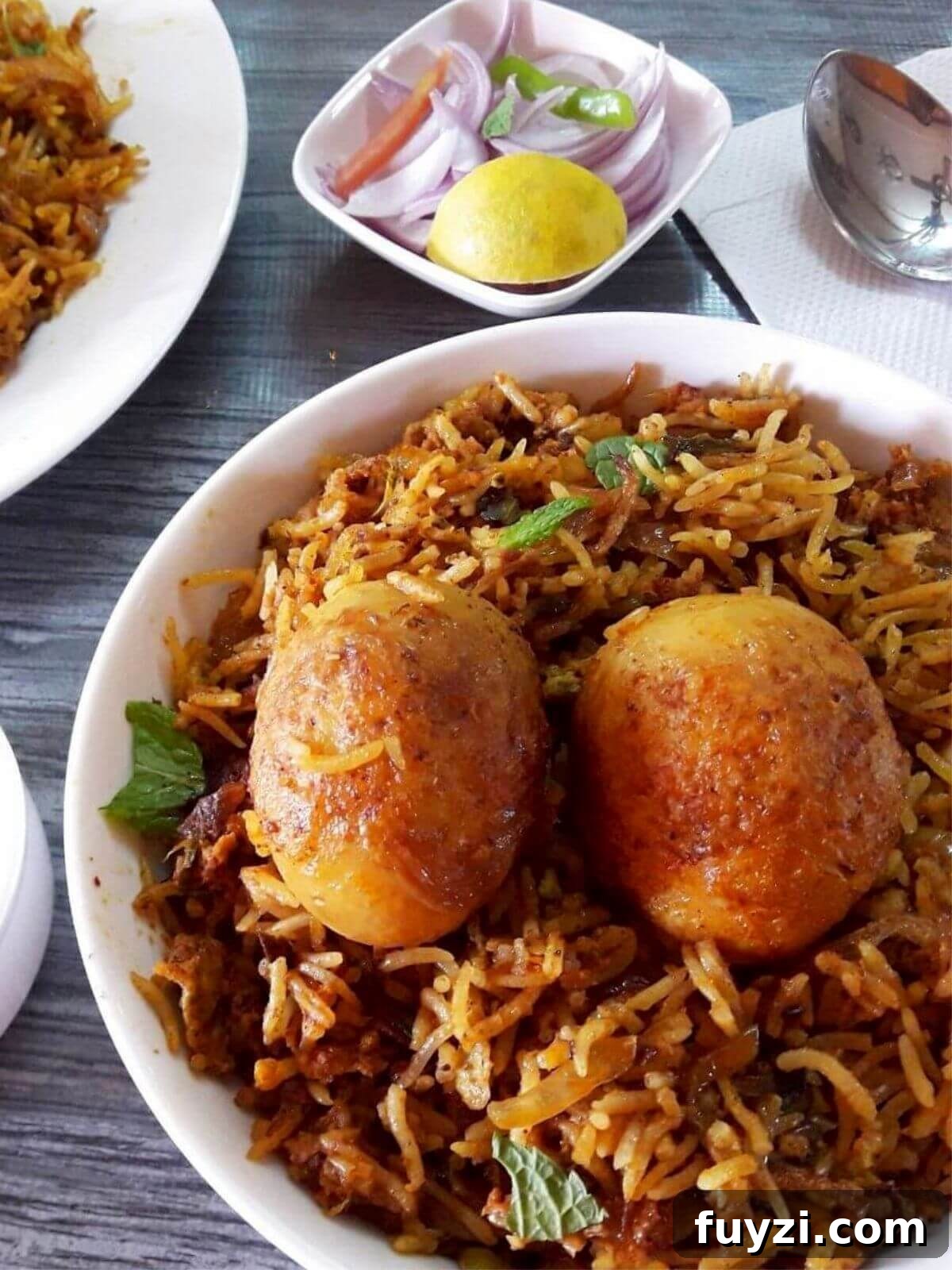close-up of egg biryani in pressure cooker.