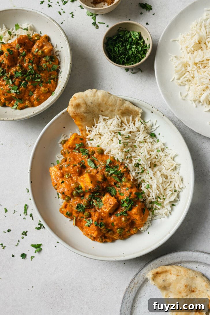 Authentic Restaurant-Style Matar Paneer Recipe 2 Matar Paneer in a plate with rice and naan.