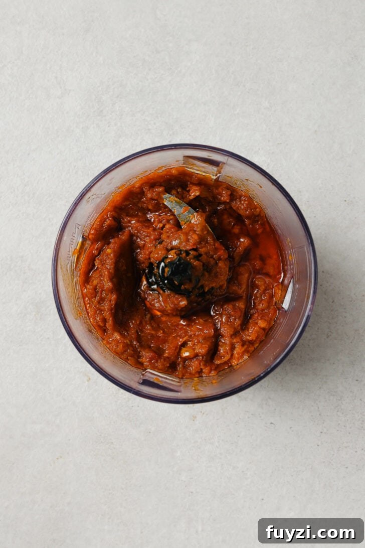 Authentic Restaurant-Style Matar Paneer Recipe 10 Onion and tomato mixture in a food processor.