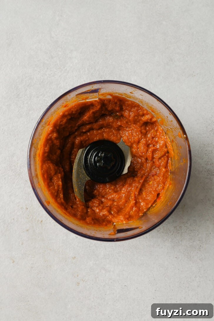 Authentic Restaurant-Style Matar Paneer Recipe 11 Puréed tomato masala in a food processor.