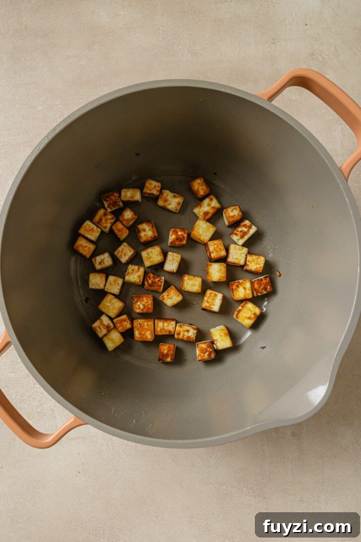 Authentic Restaurant-Style Matar Paneer Recipe 12 Pan seared paneer in a non stick pot.