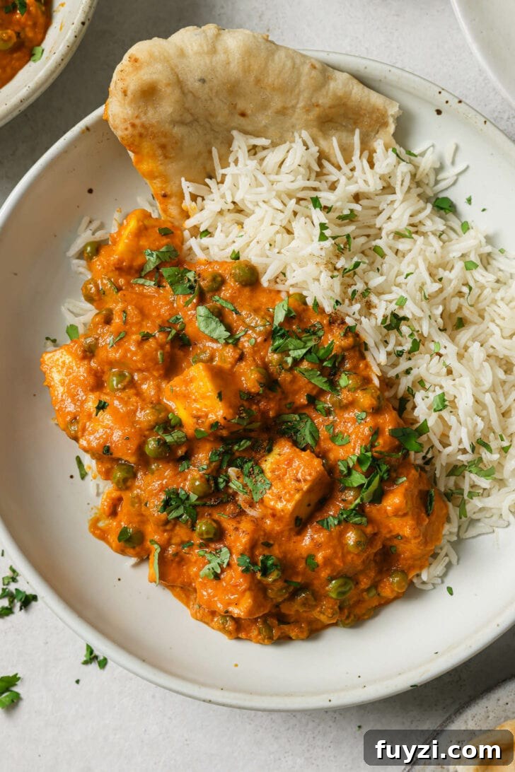 Authentic Restaurant-Style Matar Paneer Recipe 4 Close up of a plate of Matar Paneer with rice and naan.