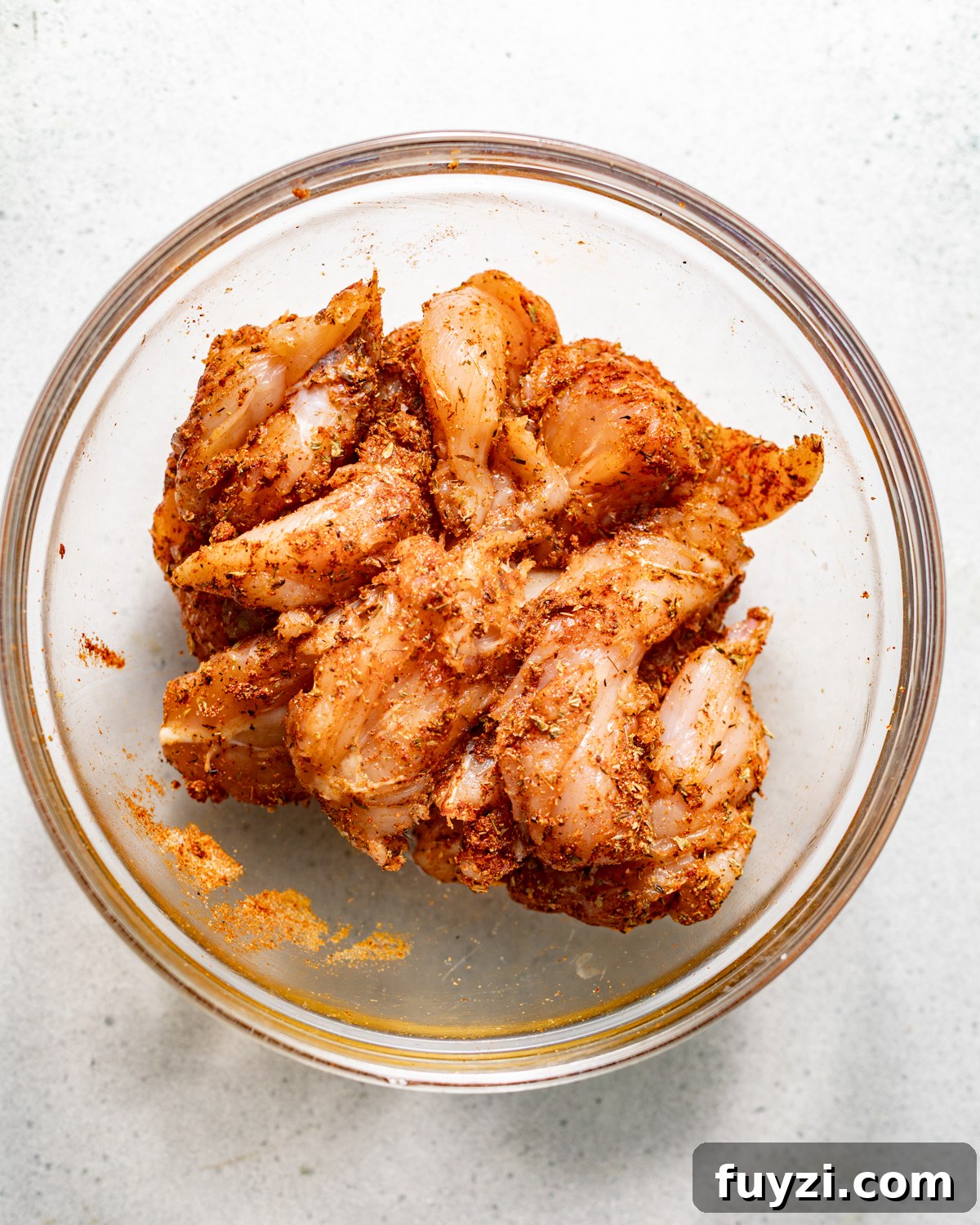 seasoned chicken in a bowl.