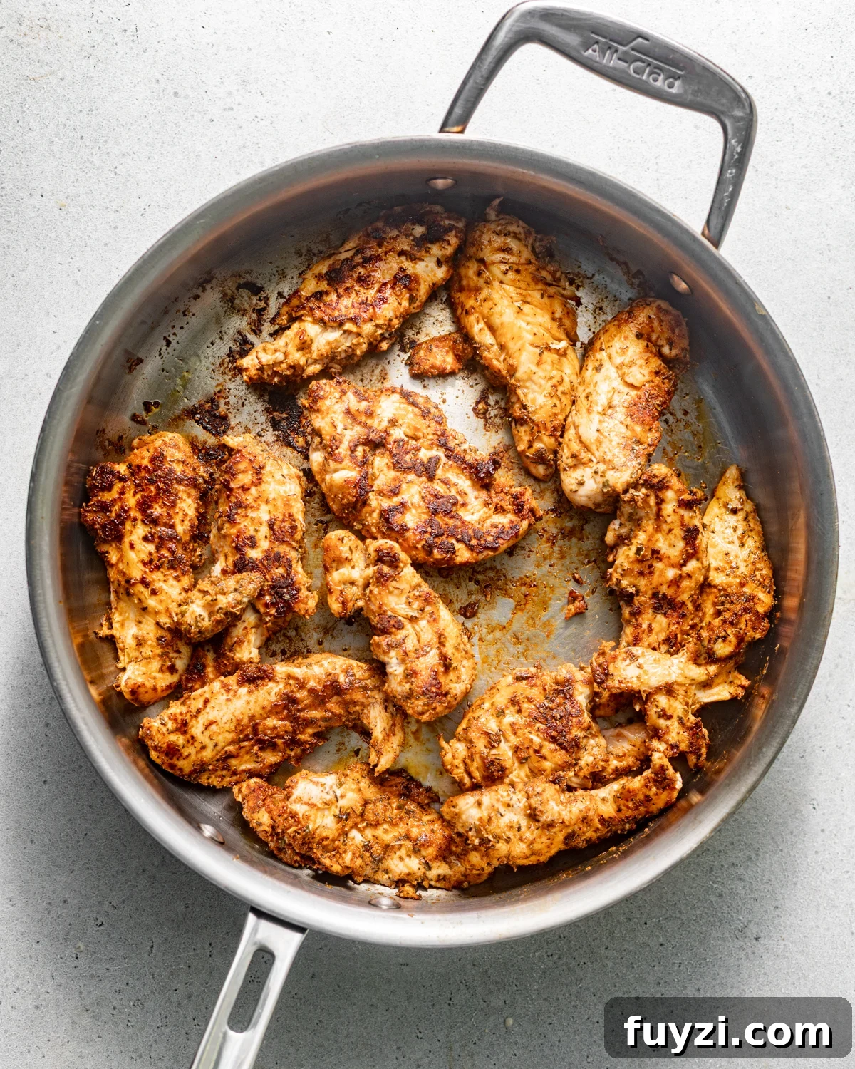 seared chicken in a skillet.