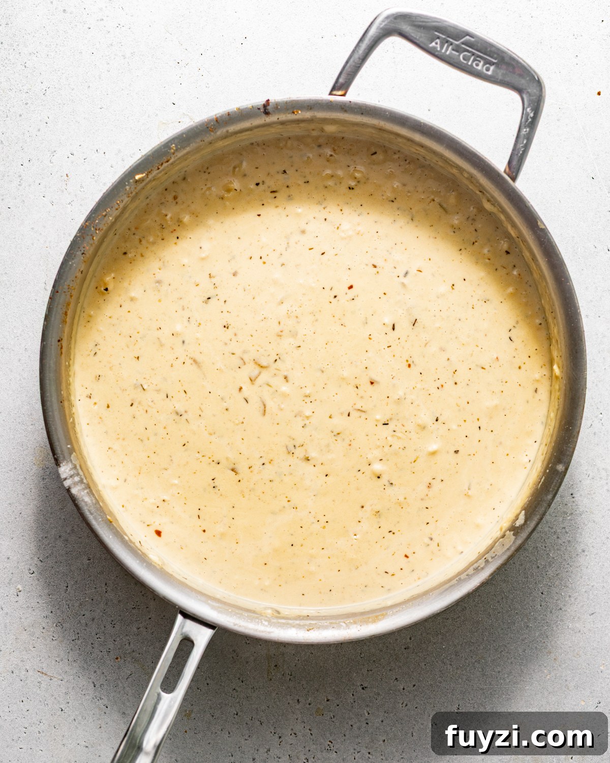 creamy alfredo sauce in a skillet.