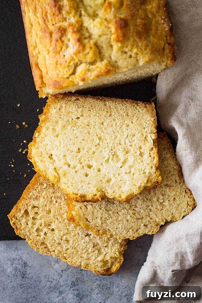overhead: easy beer bread recipe cut into slices on a counter top