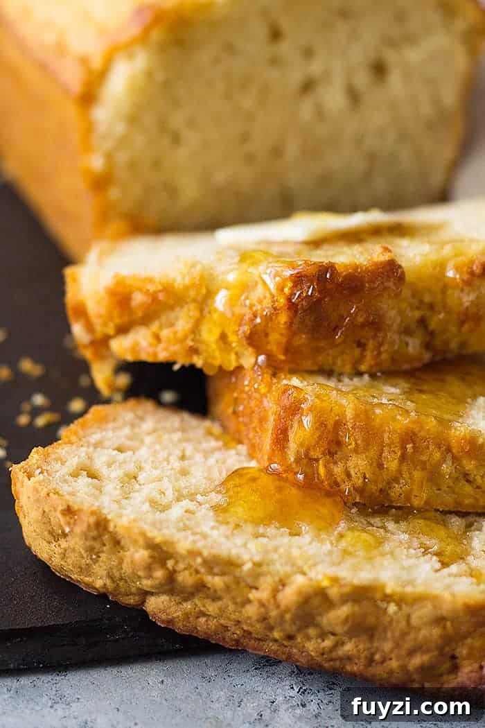 closeup: slices of beer bread with honey and butter on top