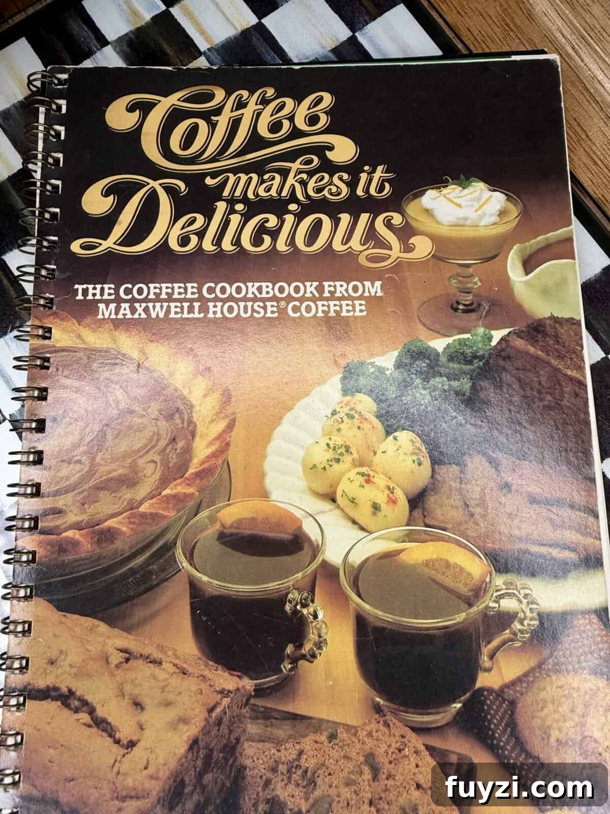 No-Bake Vintage Coffee Ice Cream Pie Recipe 3 Spiral-bound cookbook titled Coffee makes it Delicious: The Coffee Cookbook from Maxwell House Coffee, with images of coffee, bread, pie, desserts, and side dishes on the cover.