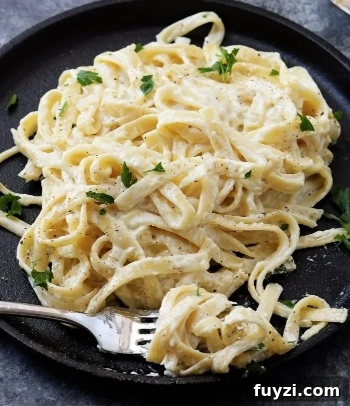Alfredo Sauce Recipe - Made of cream, butter, and garlic, this quick and easy alfredo sauce recipe comes together quickly for a comforting homemade classic! // addapinch.com