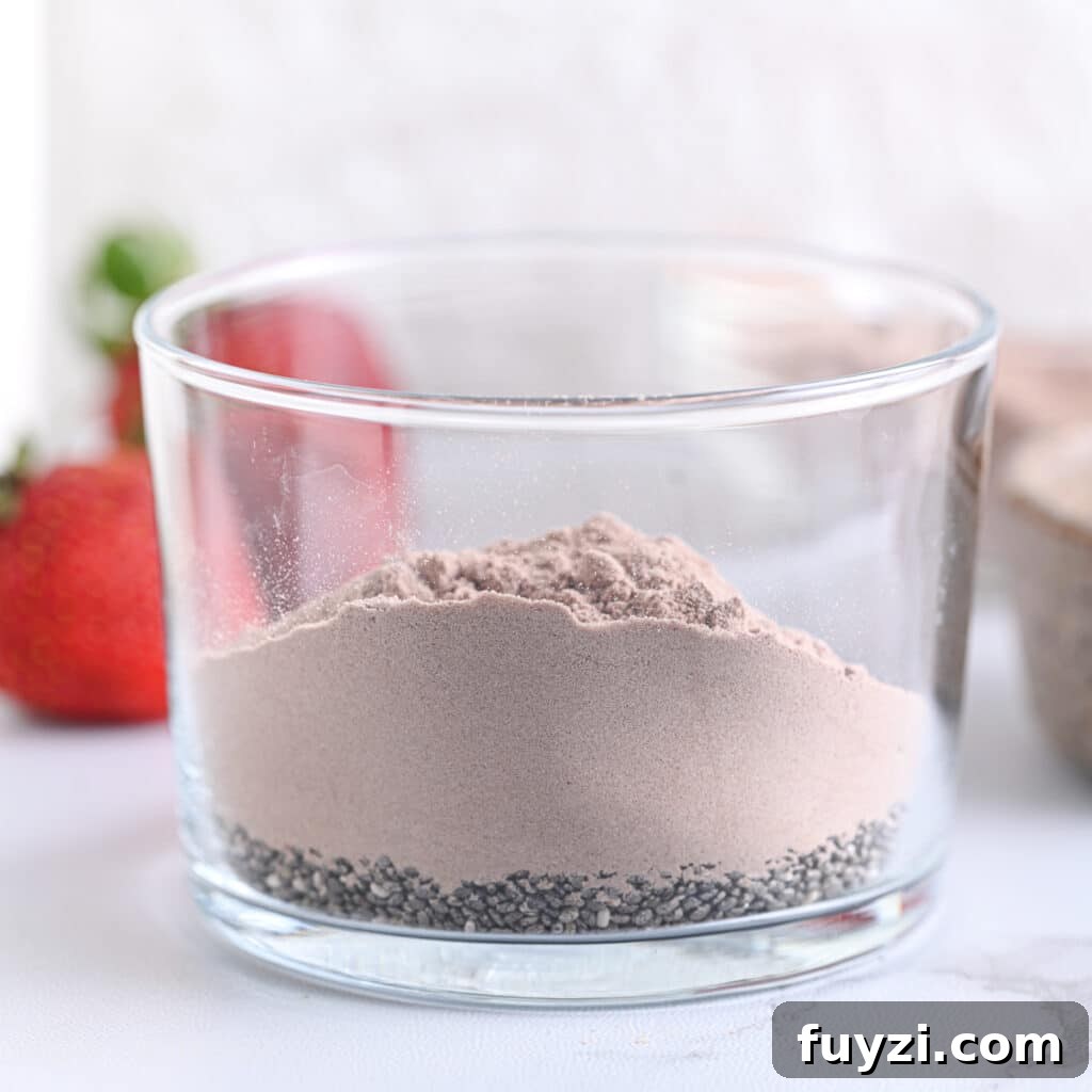 Creamy Chocolate Chia Pudding Recipe 5 Cocoa powder and chia seeds in a glass
