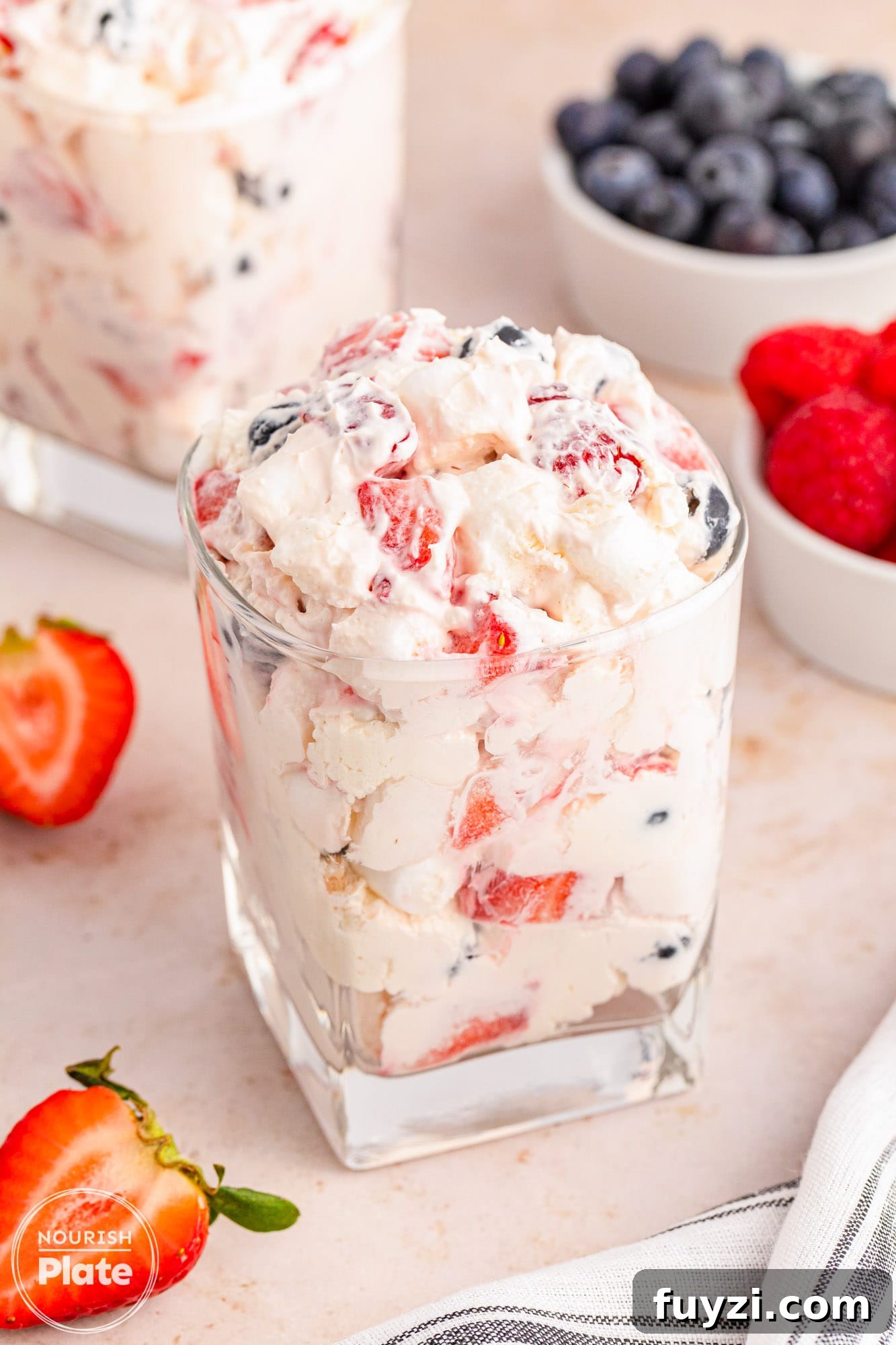 Berry cheesecake fluff salad served in transparent glass cups