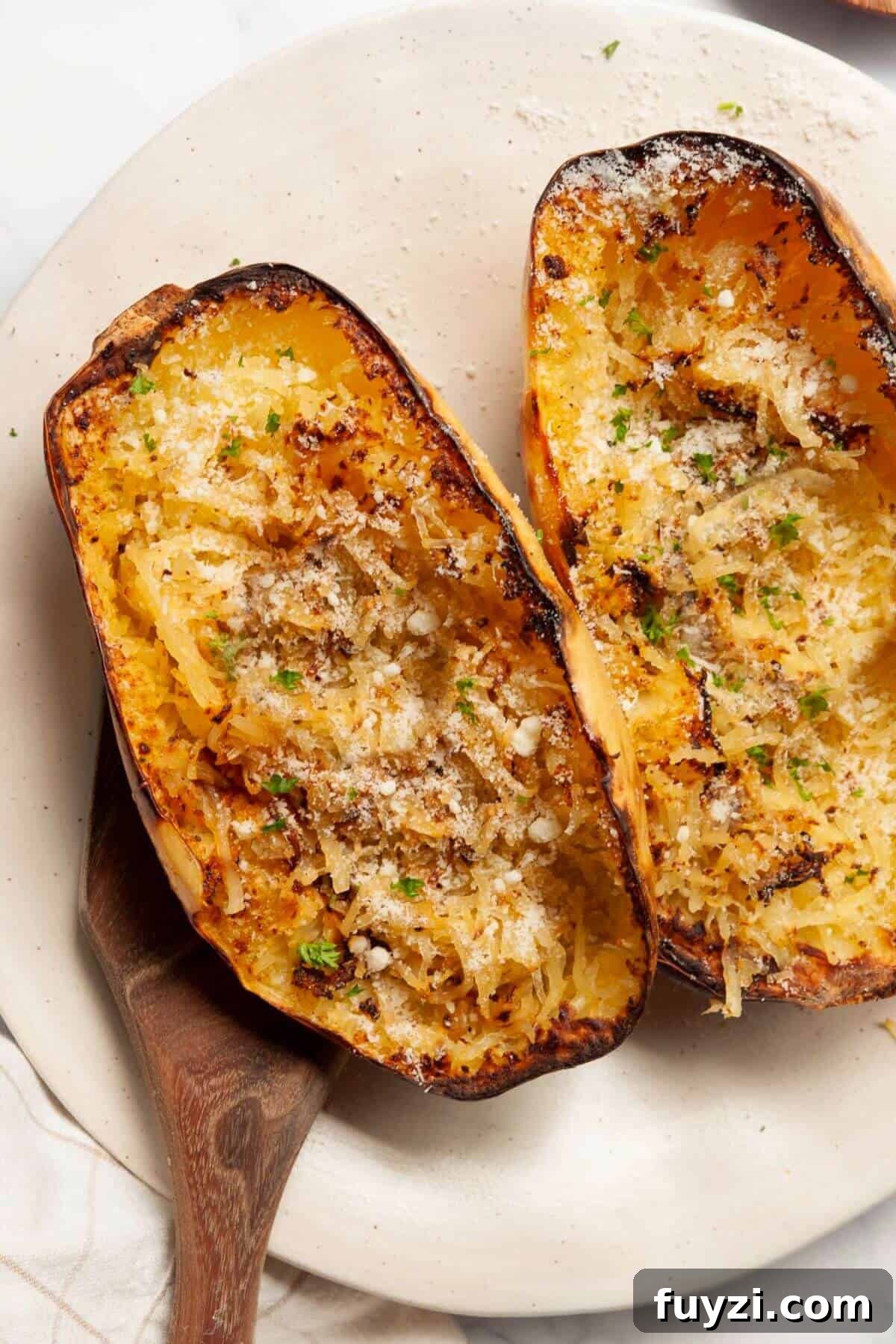 Low-carb, easy air fryer spaghetti squash served as fluffy noodles.