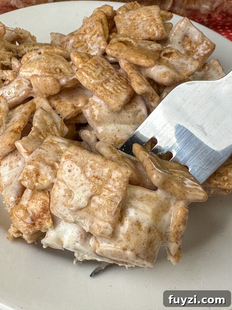 Copycat Cinnamon Toast Crunch Cereal Bars Recipe 3 Fork in a delicious homemade cereal bar made with cinnamon toast crunch cereal, melted marshmallows and butter.