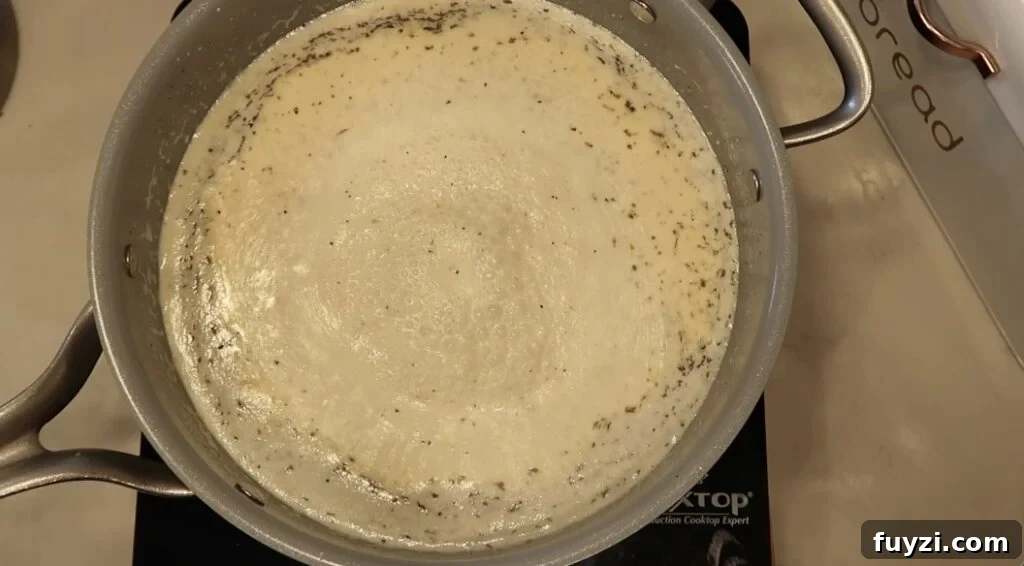 Silky Garlic Cream Sauce Recipe for Pasta and Chicken 11 Sauce in pan bubbling