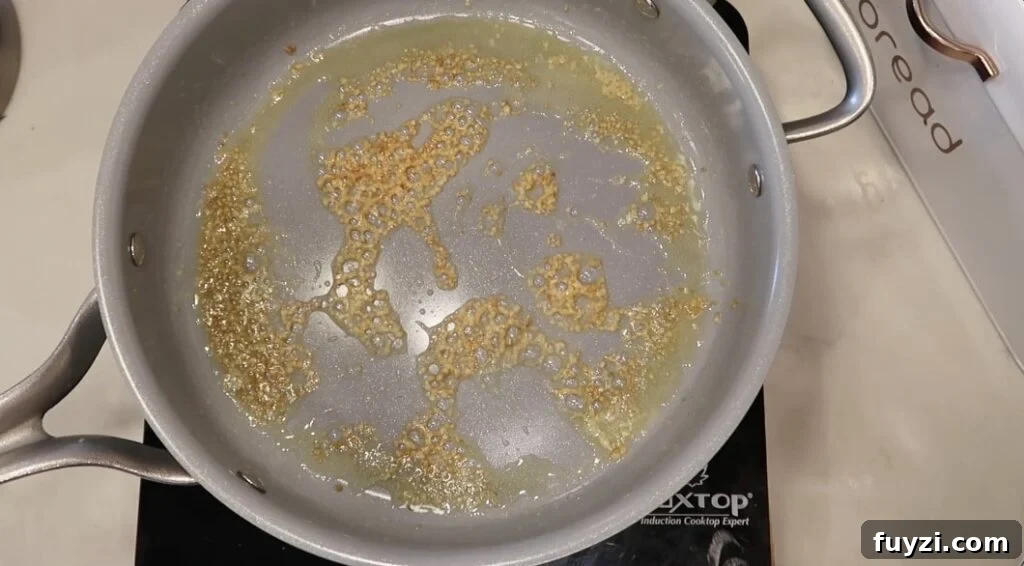 Silky Garlic Cream Sauce Recipe for Pasta and Chicken 6 Garlic sautéd to a light brown in the butter in the pan