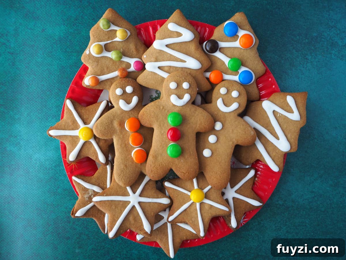 plate of gingerbread with gingerbread men, christmas trees and stars.