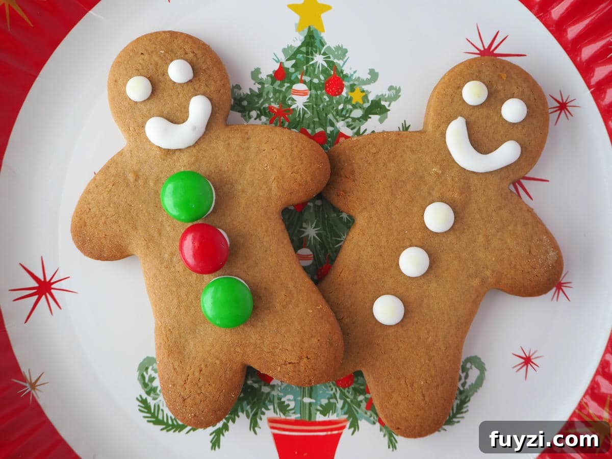 pair of gingerbread men on a Christmas plate.