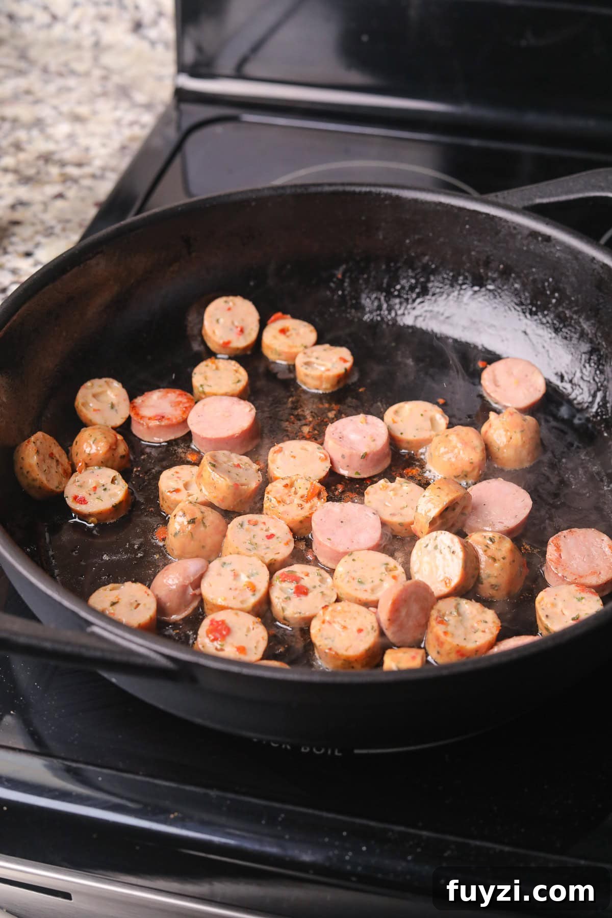 Sausage cooking in a skillet