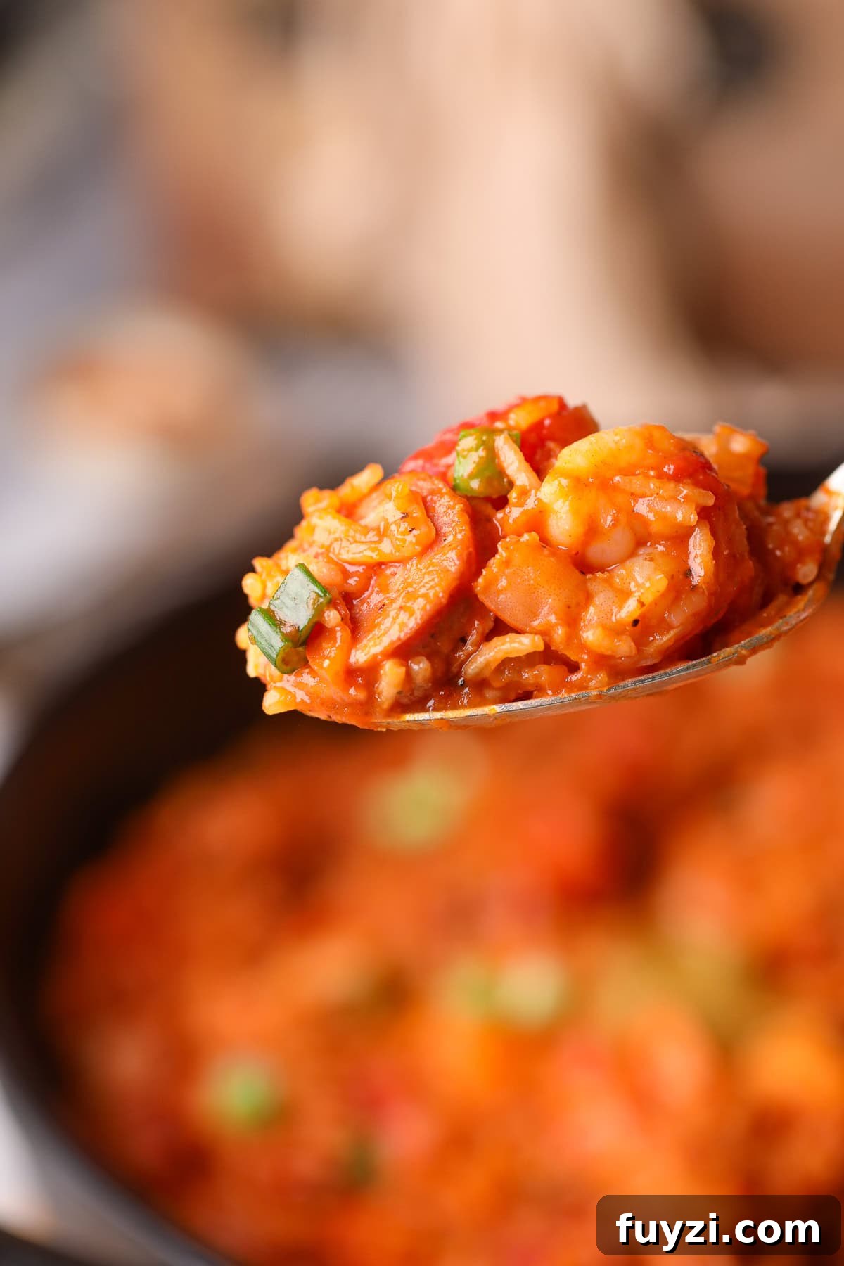 Shrimp and sausage jambalaya on a serving spoon