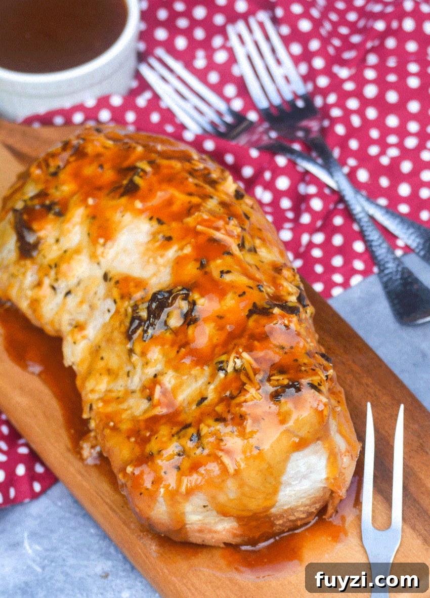 pork tenderloin slow cooker recipe on a wooden cutting board