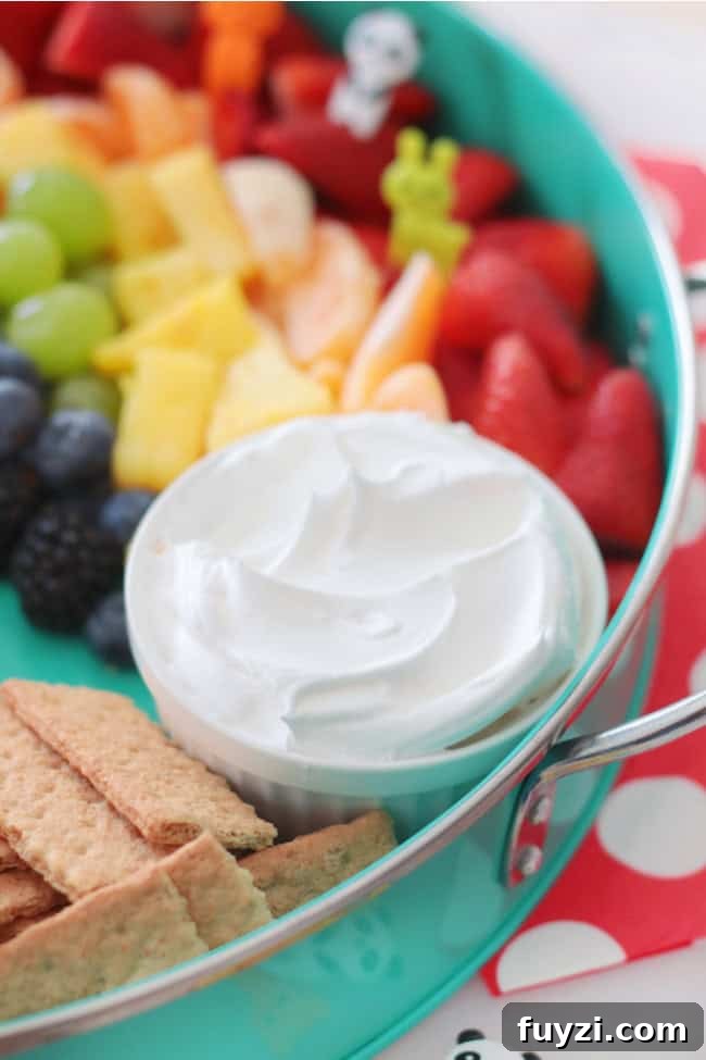 graham crackers and cool whip with fruit platter