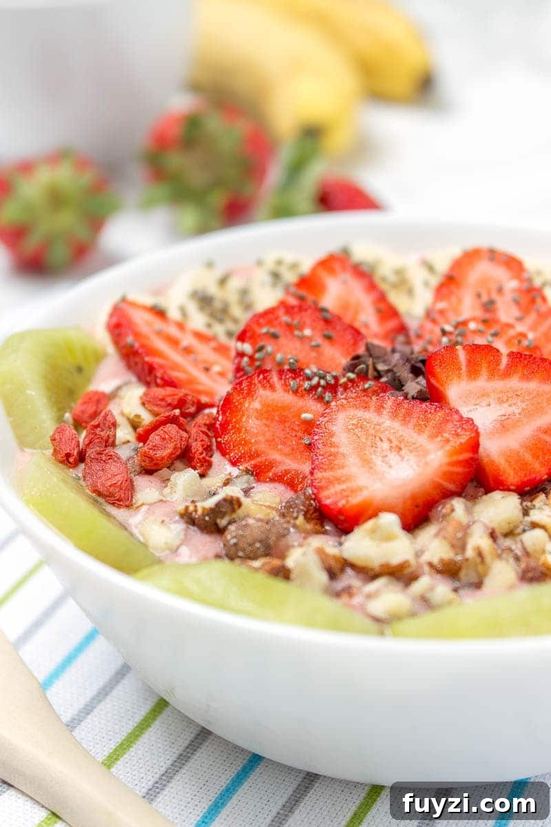 Strawberry Ginger Smoothie Bowl - creamy, sweet and ginger-spiced. Vegan, gluten-free, dairy-free, no added sugar.