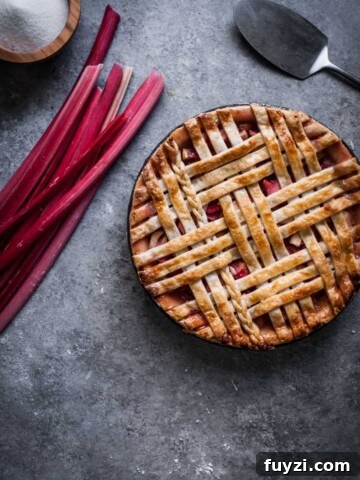 Rhubarb apple pie with an interwoven lattice crust.