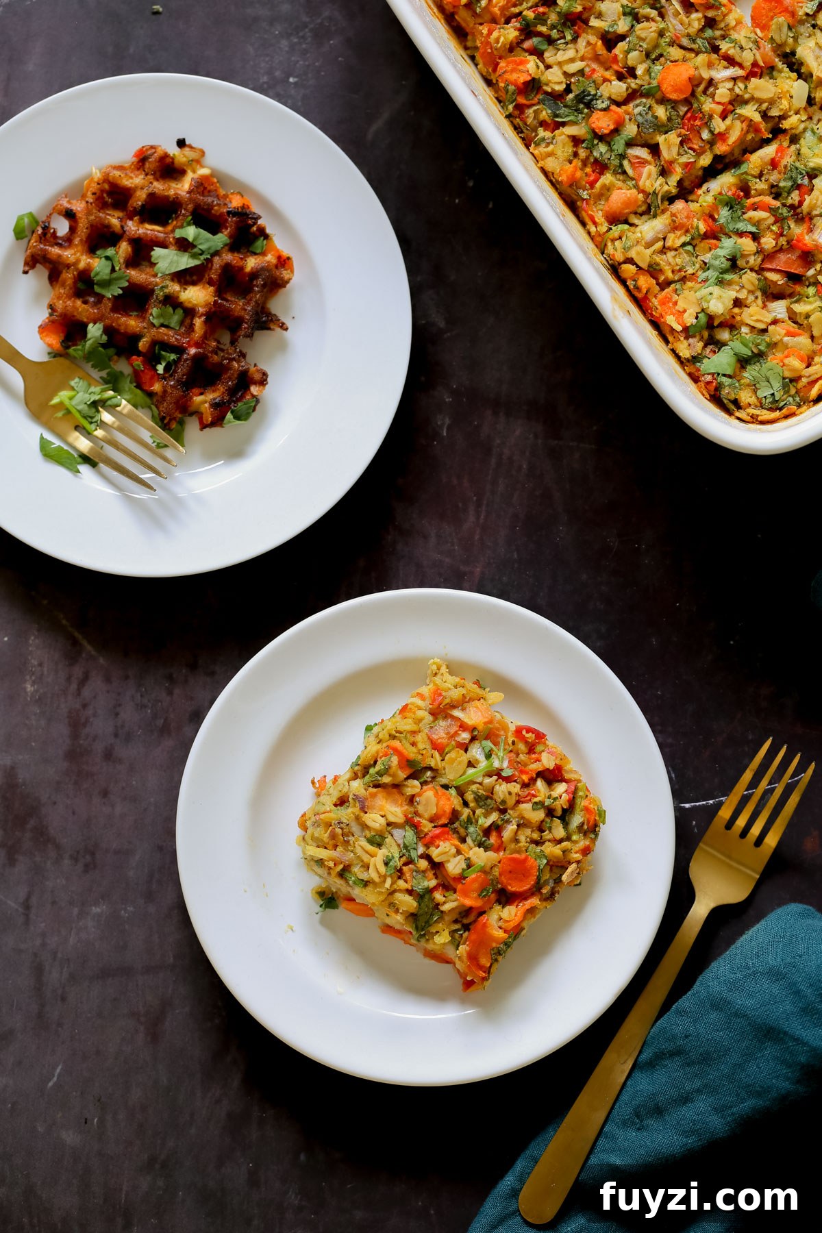 Savory Vegan Baked Oats with Roasted Vegetables 3 a piece of savory baked oats on a white plate next to the baking pan and a waffle