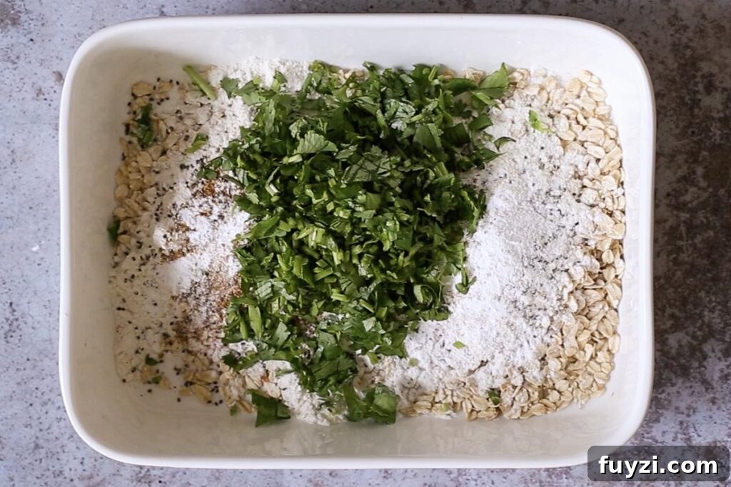 Savory Vegan Baked Oats with Roasted Vegetables 7 oats, flour, seeds, and cilantro in the baking pan before mixing