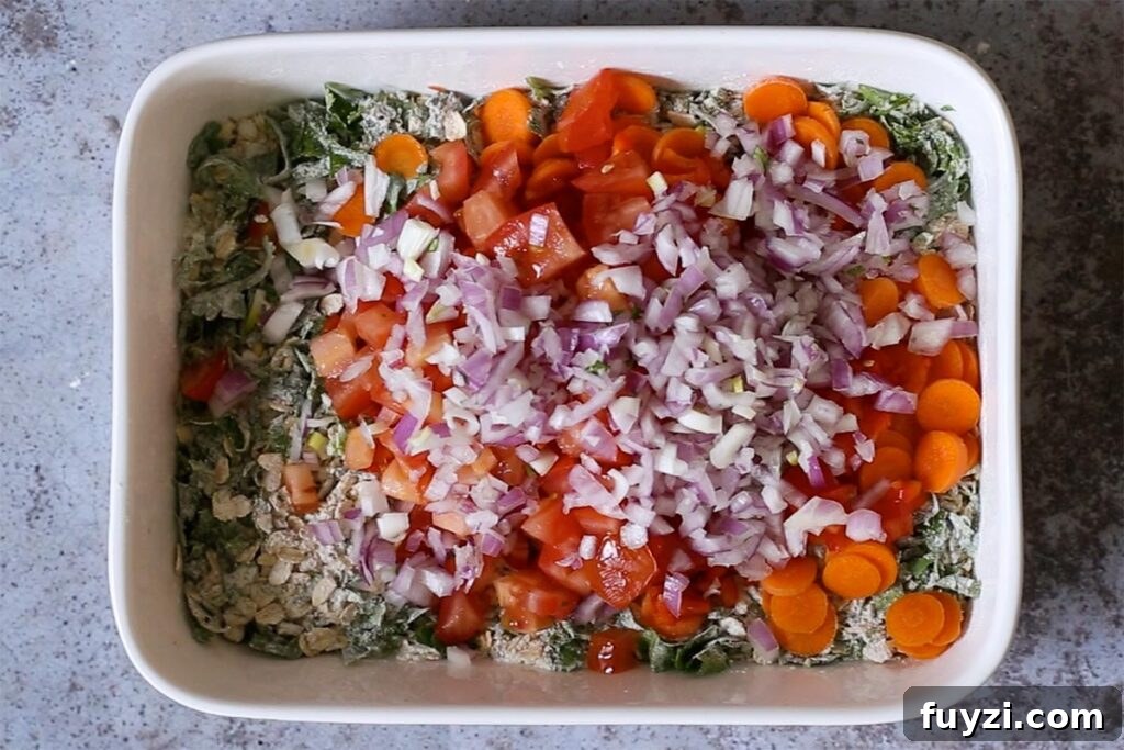 Savory Vegan Baked Oats with Roasted Vegetables 9 adding veggies to the savory oats mixture