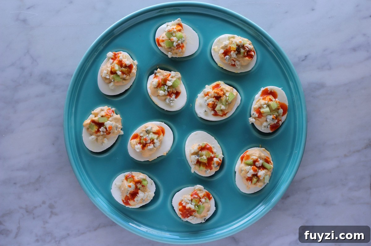 Buffalo Deviled Eggs - an easy 5-ingredient deviled egg, featuring celery, hot sauce, and blue cheese! Perfect for an appetizer or snack! | fedandfulfilled.com