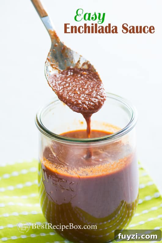 Easy Enchilada Sauce for great Mexican Recipes in a glass with spoon 