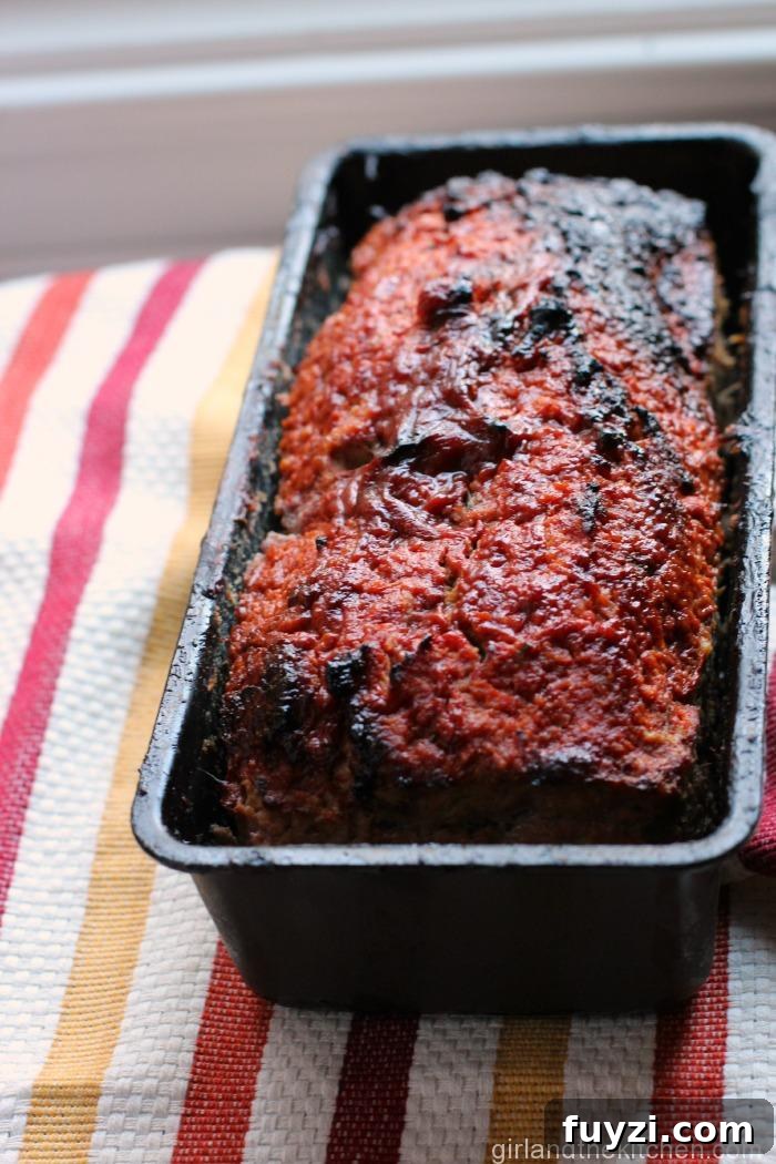 Juicy Turkey Meatloaf with Rosemary 5 Meatloaf sliced on a plate