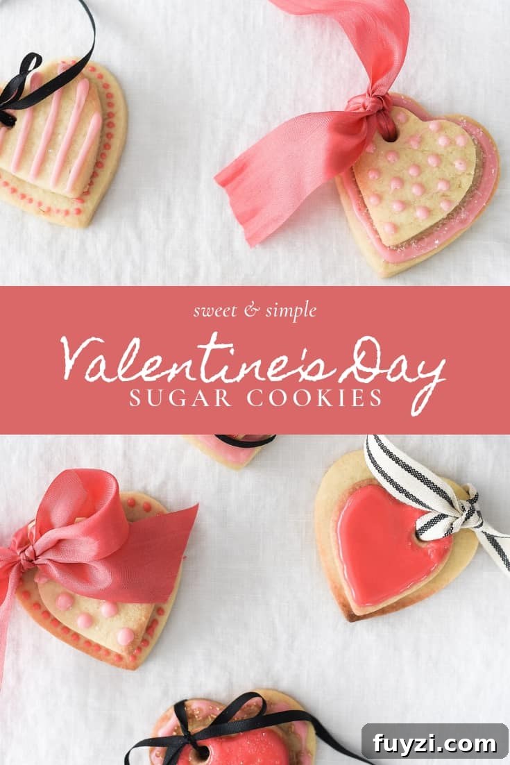 These Valentine’s Day sugar cookies are topped with simple royal icing and sprinkles and couldn’t be cuter! Use a little ribbon to turn these Valentine’s Day sugar cookies into the sweetest Valentine treat!