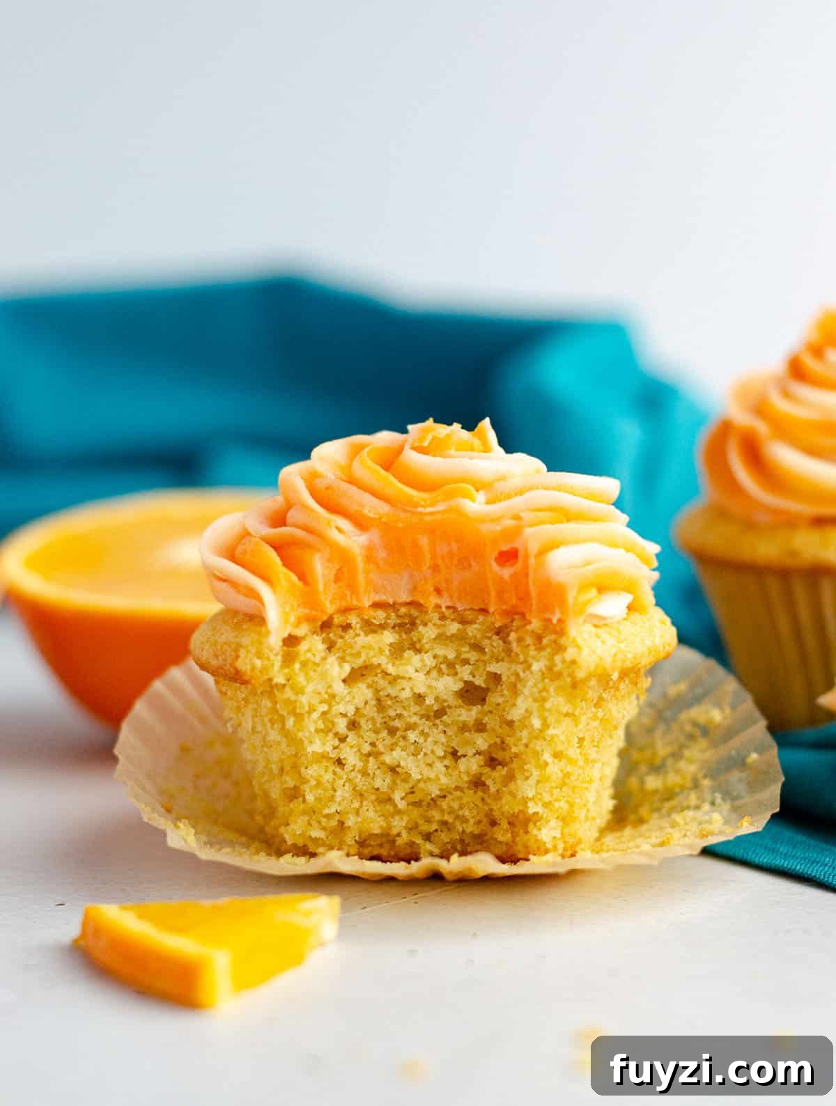 Orange Creamsicle Cupcakes: Simple orange cupcakes topped with swirls of orange and cream cheese frostings.