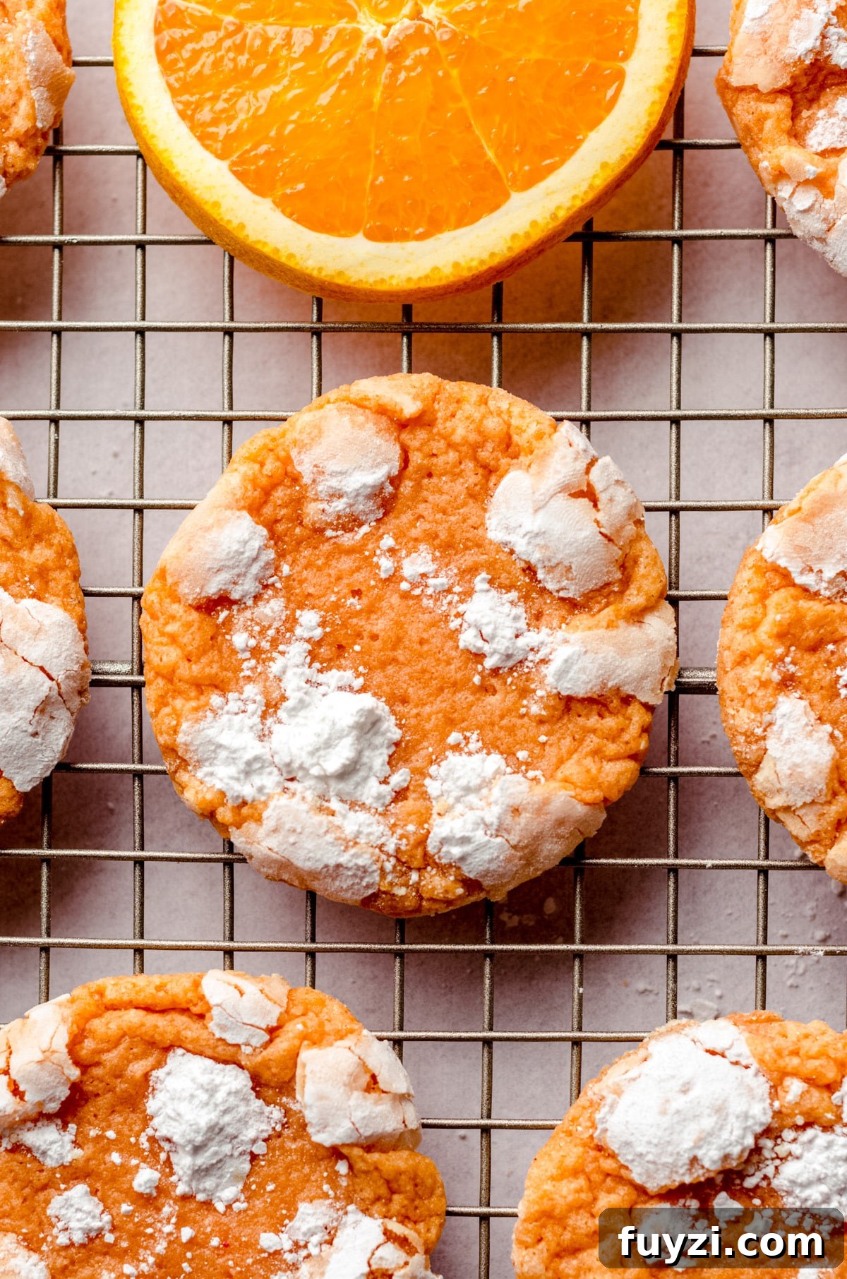 aerial photo of orange creamsicle cookies on a wire cooling rack