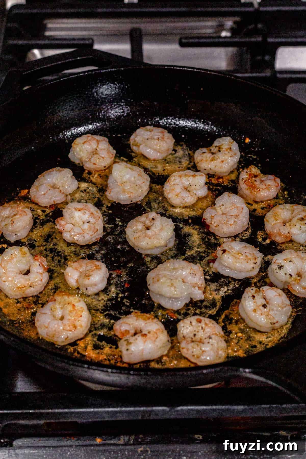 How to Make Creamy Coconut Shrimp 4 pan seared shrimp in a skillet.