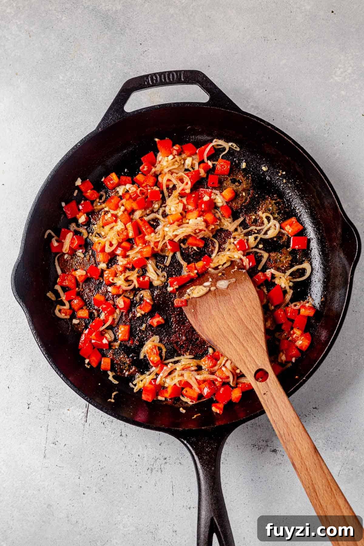 How to Make Creamy Coconut Shrimp 5 sauteed red peppers and shallots in a skillet.