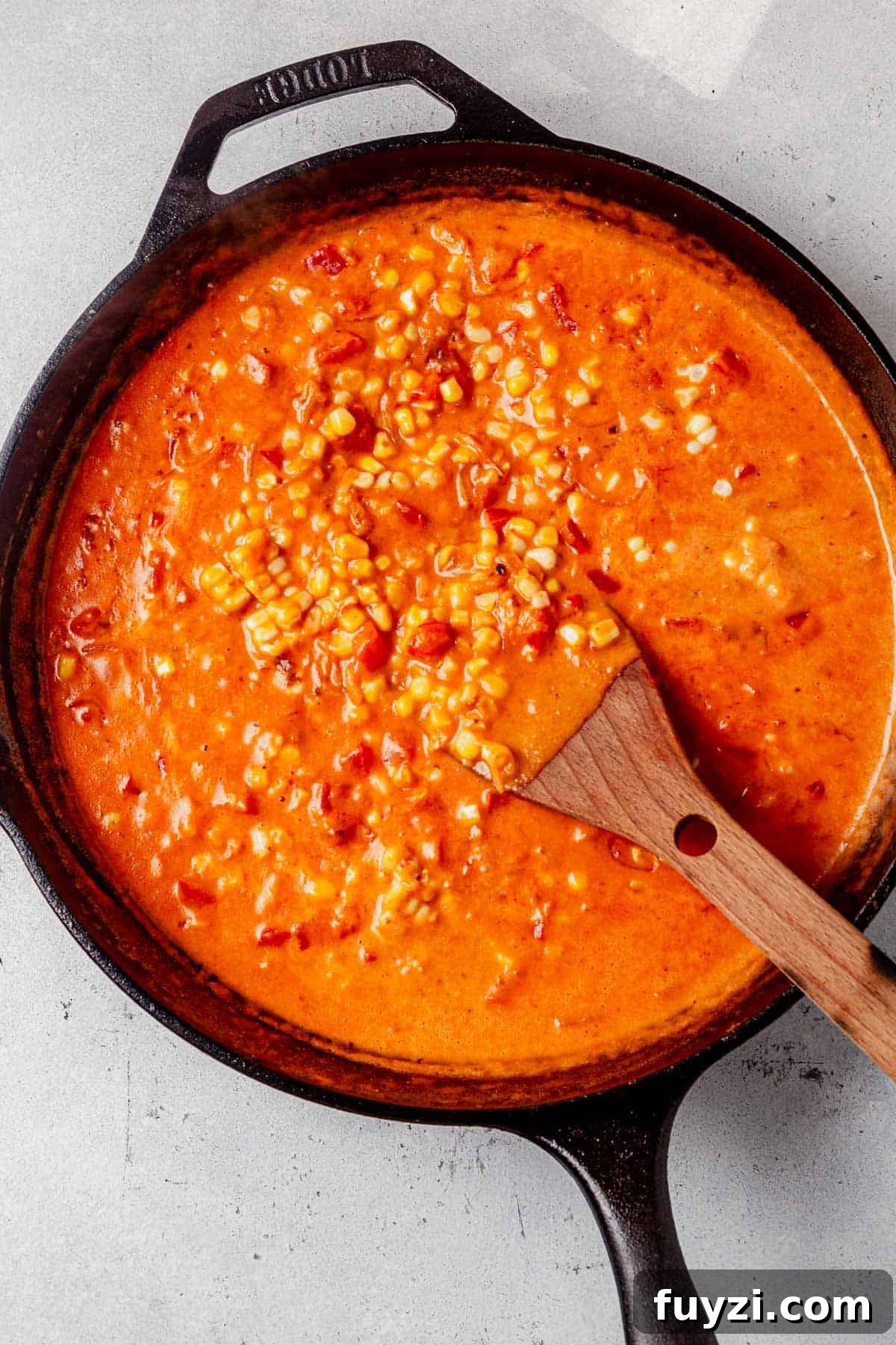 How to Make Creamy Coconut Shrimp 6 creamy tomato coconut milk sauce in a skillet.
