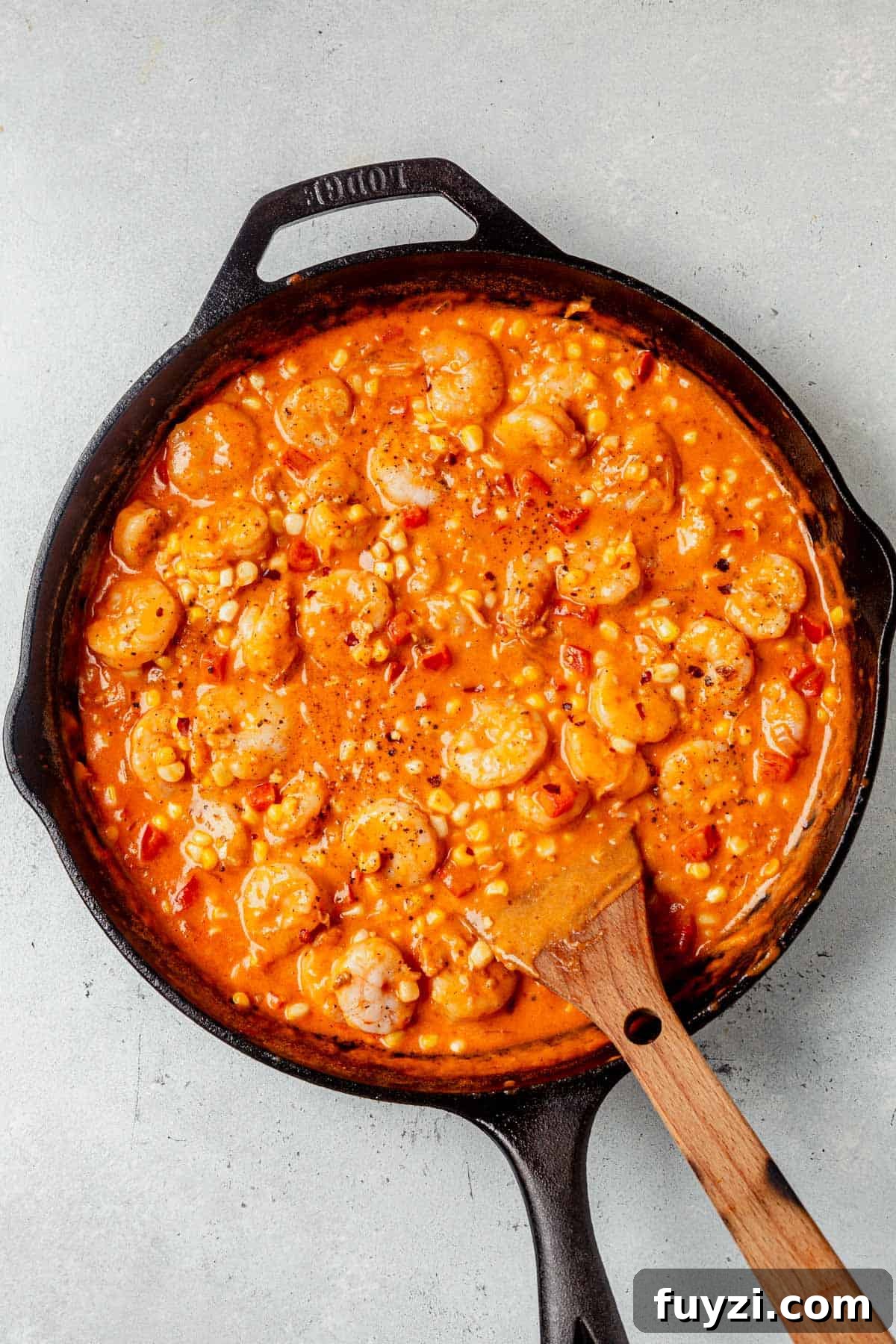How to Make Creamy Coconut Shrimp 7 creamy coconut shirimp in a cast iron skillet.