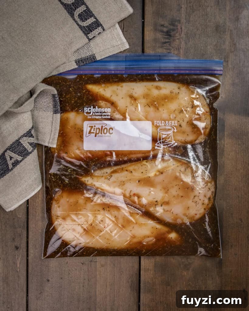 Chicken marinating in a bag