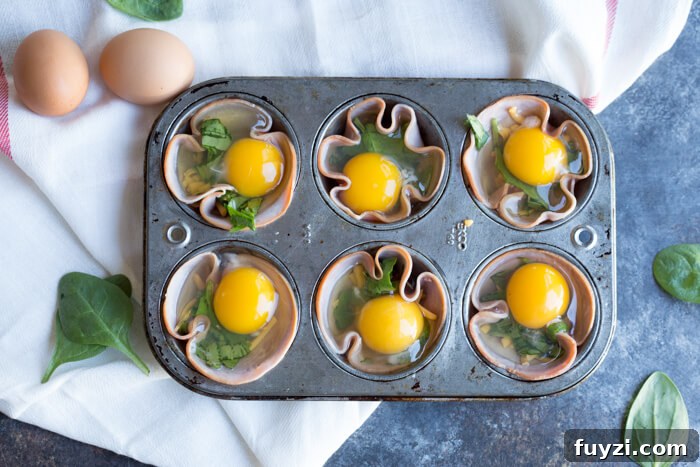 Ham Spinach Egg Cups are an easy meal prep that is high in protein and low carb. Simply bake in a muffin tin to have a healthy breakfast at the ready... made with only 4 ingredients! 