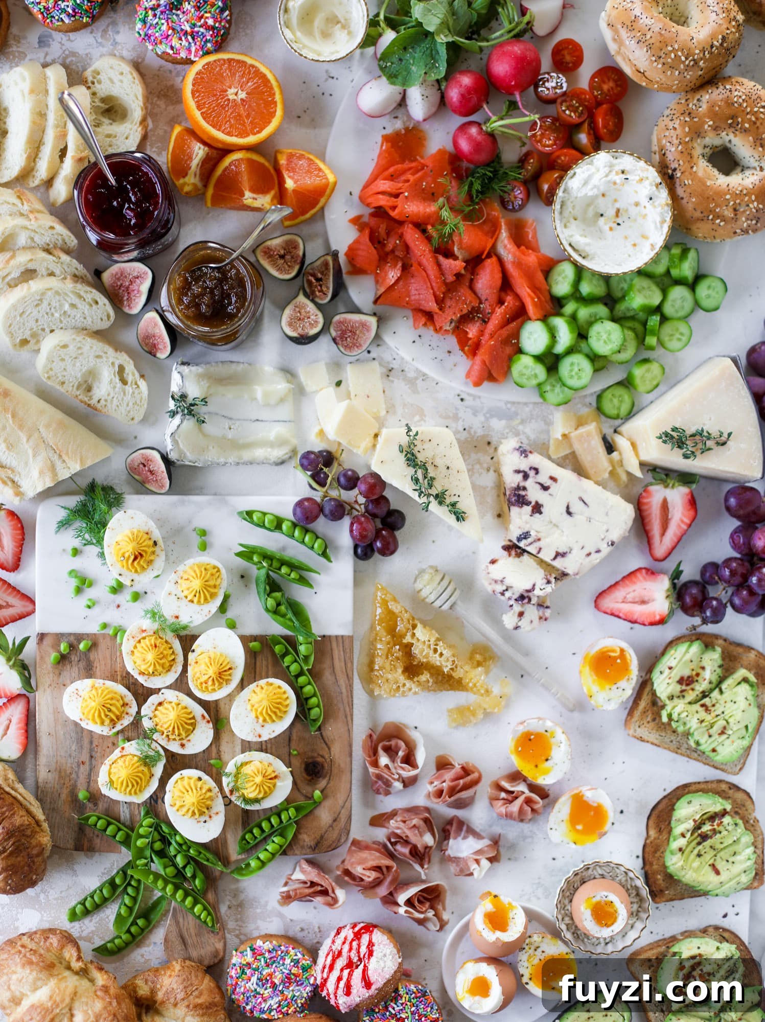 The highlight of this Easter brunch board are the deviled eggs and soft boiled eggs! Add some avocado toast, donuts and bloody marys and you've arrived. I howsweeteats.com #brunch #board