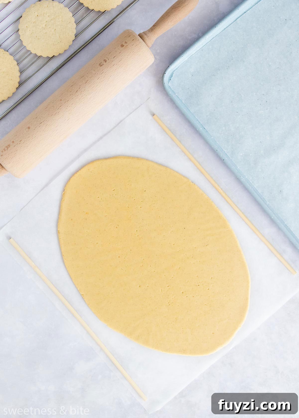 How to Make Soft Gluten-Free Sugar Cookies 3 Rolled out gluten free cookie dough with dowels for even thickness.
