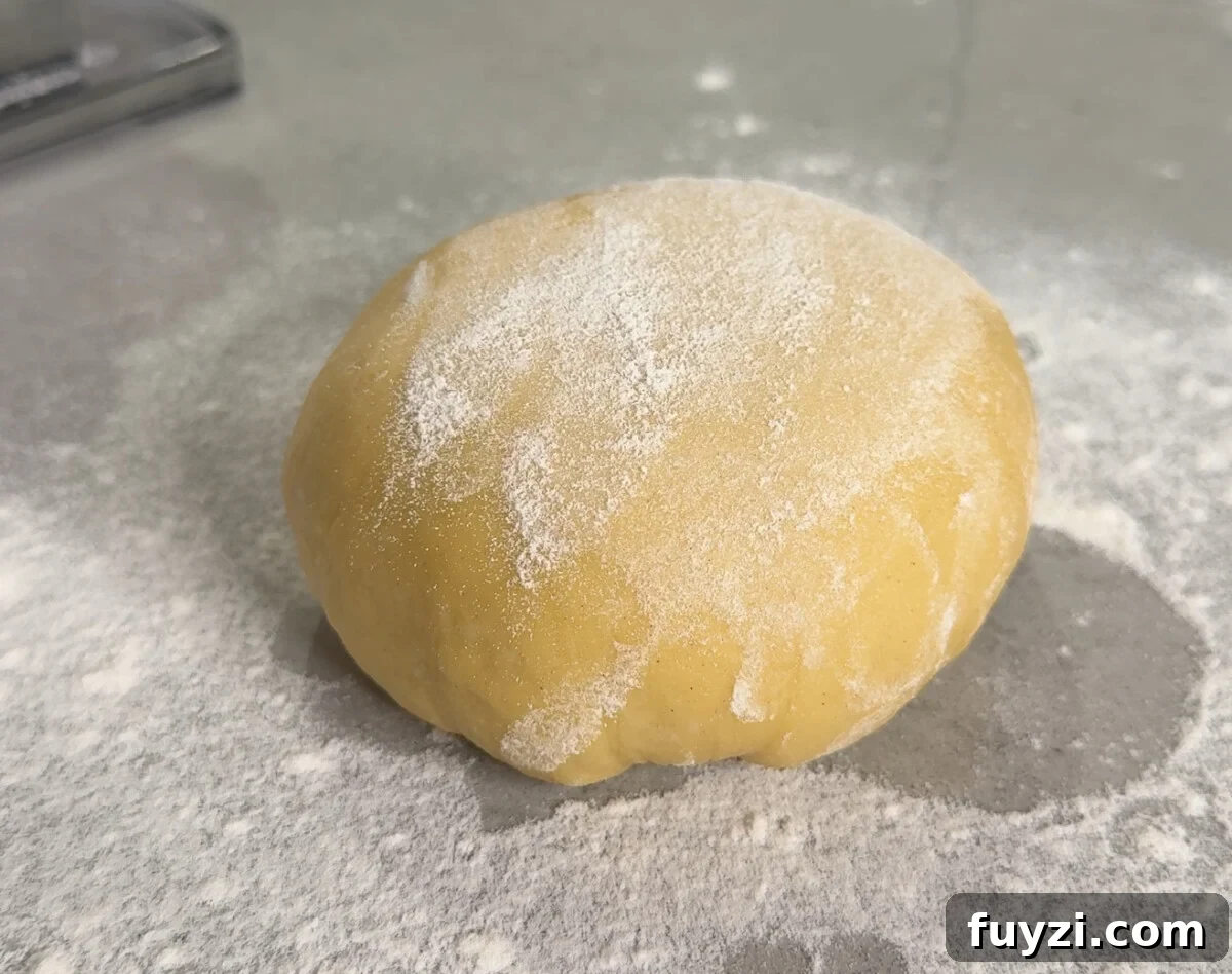 How to Make Fresh Pasta Dough at Home 2 Fresh pasta dough on a wooden surface