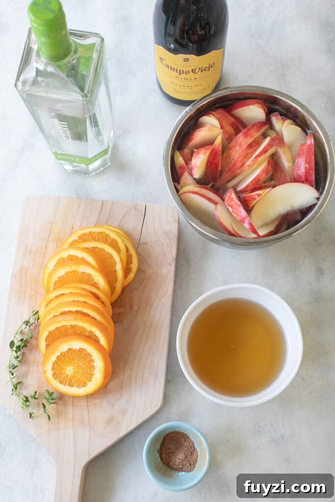 Spiced Autumn Apple and Pear Sangria Recipe 4 Apple slices, orange slices, apple cider, red wine, apple vodka.