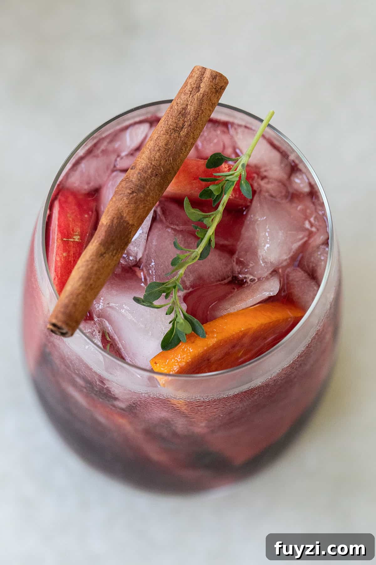 Spiced Autumn Apple and Pear Sangria Recipe 6 Fall sangria with a cinnamon stick.