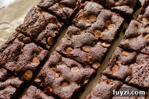 Fudgy Chunky Chocolate Chip Brownies Recipe 11 Chunky Chocolate Chip Brownies on brown parchment paper